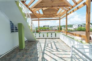 a view from the balcony of a building with a wooden roof at Ventura Living in Nagua