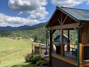 a gazebo with a view of the mountains at Phobos Cabin in Mars Hill