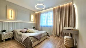 Ένα ή περισσότερα κρεβάτια σε δωμάτιο στο Apartament Natura