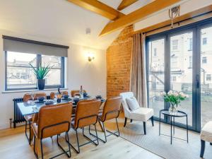 a dining room with a table and chairs and a large window at 3 Bed in Harrogate 86490 in Harrogate +7 photos