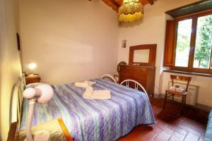 A bed or beds in a room at Casa Vacanza Le Corniole