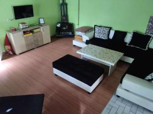 a living room with a couch and a coffee table at Smestaj Irina`Relax House in Novi Bečej