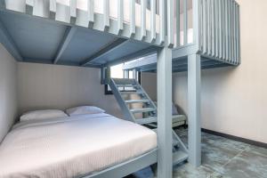 a bedroom with a bunk bed and a staircase at Naomi Boutique Villa with private pool in Netu'a +38 photos