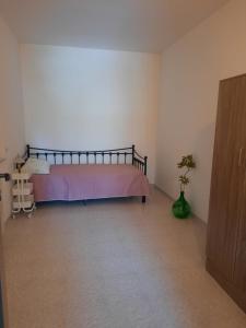 a bedroom with a bed in the corner of a room at Villa Francesca A in Roccagloriosa +2 photos