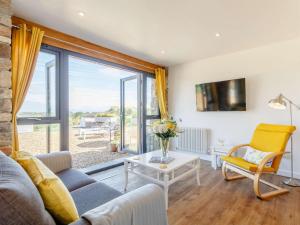 a living room with a couch and a table at 1 Bed in Weston-Super-Mare 78986 in Weston-super-Mare