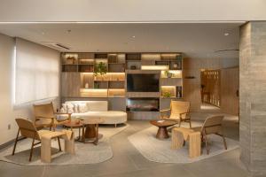 Un televizor și/sau centru de divertisment la Intercity Porto Alegre Aeroporto