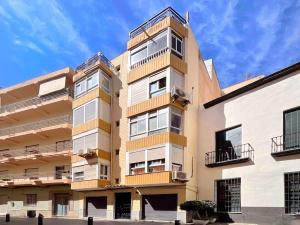 an apartment building with balconies on the side of it at Lope de Vega by Kaleria Suites in Almería