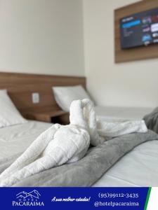 Postel nebo postele na pokoji v ubytování Hotel Pacaraima + 6 fotografií