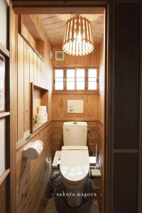 a bathroom with a toilet and a chandelier at Nagoya - House - Vacation STAY 7563 in Nagoya