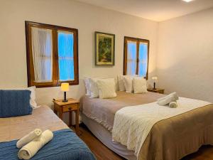 Ένα ή περισσότερα κρεβάτια σε δωμάτιο στο Pousada Hortelã +184 φωτογραφίες