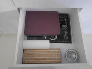 a box with a laptop and other items in it at Villa family in Ban Saiyuan (1)