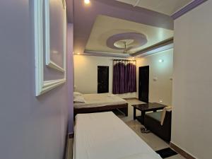 Postel nebo postele na pokoji v ubytování SN3 Hotel