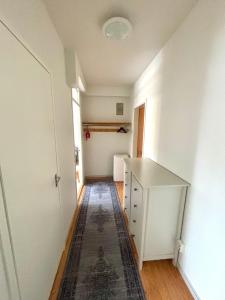 an empty room with a desk and a hallway at Interesting Kemi Apartment with peaceful environment free parking in Kemi