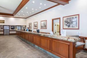 a lobby with a long counter in a building at Waikiki Banyan #3013 - Tower 2 in Honolulu