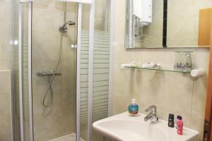 a bathroom with a shower and a sink at Apartments Bella in Vodice