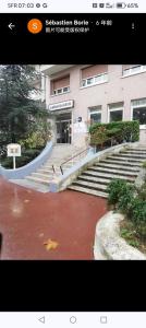 a group of stairs in front of a building at Les nouveaux Ambassadeurs in Saint-Chamond