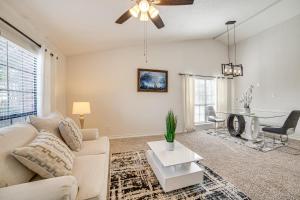 a living room with a couch and a table at Fenced-In Yard Home Less Than 1 Mi to Lake Ray Hubbard! in Faulkner Point Heliport