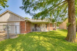 a brick house with a tree in the yard at Fenced-In Yard Home Less Than 1 Mi to Lake Ray Hubbard! in Faulkner Point Heliport