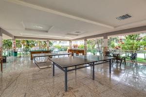 a room with tables and chairs in a building at diRoma Lacqua I direto com o Grupo diRoma com acesso ao Acqua Park e Café da manhã in Caldas Novas