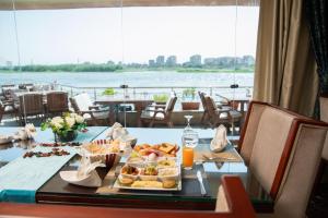 a table with a tray of food and drinks at Nile Transport Hotel in Cairo