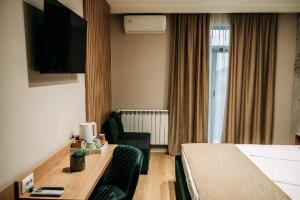 TV a/nebo společenská místnost v ubytování Casa Dragan