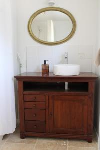 a bathroom vanity with a sink and a mirror at Le Laoul cottage 2 people in Bourg-Saint-Andéol