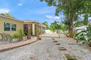 a house with a gravel yard in front of it at Datura Dreams in Southgate