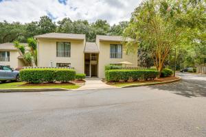 a house with a car parked in front of it at Walk to Folly Field Beach Condo with Pool Access in Hilton Head Island