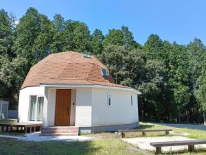 a small building with a tiled roof on a field at Star Dome - Vacation STAY 20283 in Shimoda