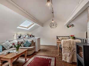 a living room with a couch and a table at 1 Bed in Eskdale 95105 in Eskdale +24 photos