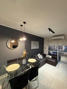 a living room with a couch and a table at Dpto Santiago Centro in Resistencia +3 photos