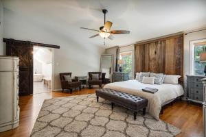 a bedroom with a bed and a ceiling fan at The Graham Escape - Memphis Vibe in Memphis