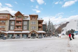 a building on a ski slope in the snow at Fore Seasons Escape with Golf in Backyard in Blue Mountains
