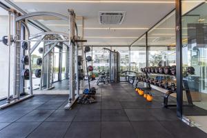 a gym with a bunch of equipment in a room at Stylish Luxury Apartment - Fully Equipped in Asuncion