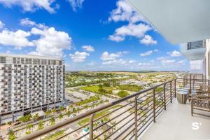 a balcony with a view of a city at DTW Doral 2BD Condo Skyline Views in Miami