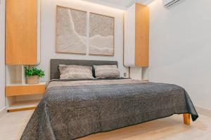 a bedroom with a large bed in a room at Pueblito luxury apartment in Playa del Carmen +23 photos