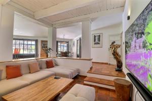 a living room with a couch and a table at Summer Gem - Nature & Swimming Pool in Ventabren +16 photos