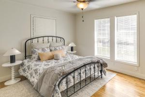 a bedroom with a bed and two windows at Downtown Home! Walk to Oxford Square and Ole Miss in Oxford