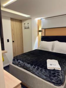 Ένα ή περισσότερα κρεβάτια σε δωμάτιο στο Hotel Biba Life - Chia +27 φωτογραφίες