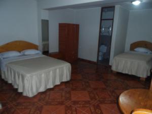Letto o letti in una camera di Antares Inn