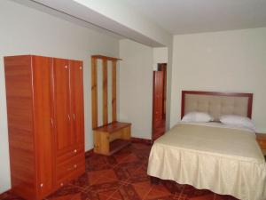 Letto o letti in una camera di Antares Inn
