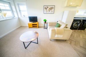 a living room with a couch and a coffee table at 2 Bed Property, Beauly in Beauly