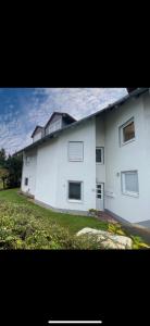 a large white house with windows on a yard at Apartment in Marburg in Marburg an der Lahn