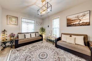 a living room with two couches and a rug at 1 Mi to Dtwn Elgin Dutch Colonial with Lovely Patio in Elgin