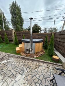 a backyard with a fire pit in the yard at Swiss House Dilijan in Dilijan +42 photos