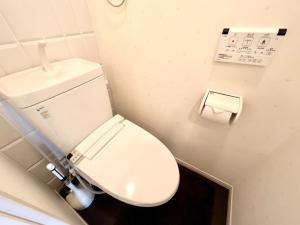 a bathroom with a toilet and a roll of toilet paper at P,marks Arata - Vacation STAY 16694 in Kagoshima +1 photo