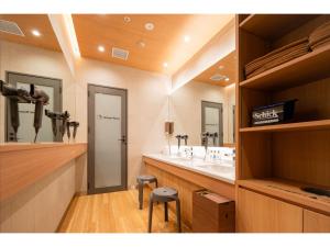 a bathroom with two sinks and two mirrors at Kisuke no yado - Vacation STAY 91620v in Matsuyama +16 photos