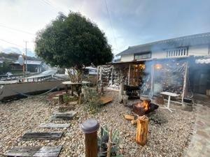 a backyard with a fire pit and a building at KuraKura Village - Vacation STAY 39459v in Kami-ichi