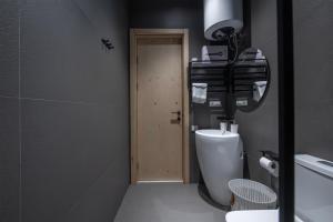 a bathroom with a toilet with a camera on top of it at 5 Star Duluxe Apartment in Villa Magnetica in Ozurgetʼi +16 photos