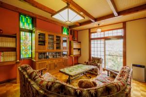 a living room with a couch and a table at -IRAKA- - Vacation STAY 19152 in Shiroishi +49 photos